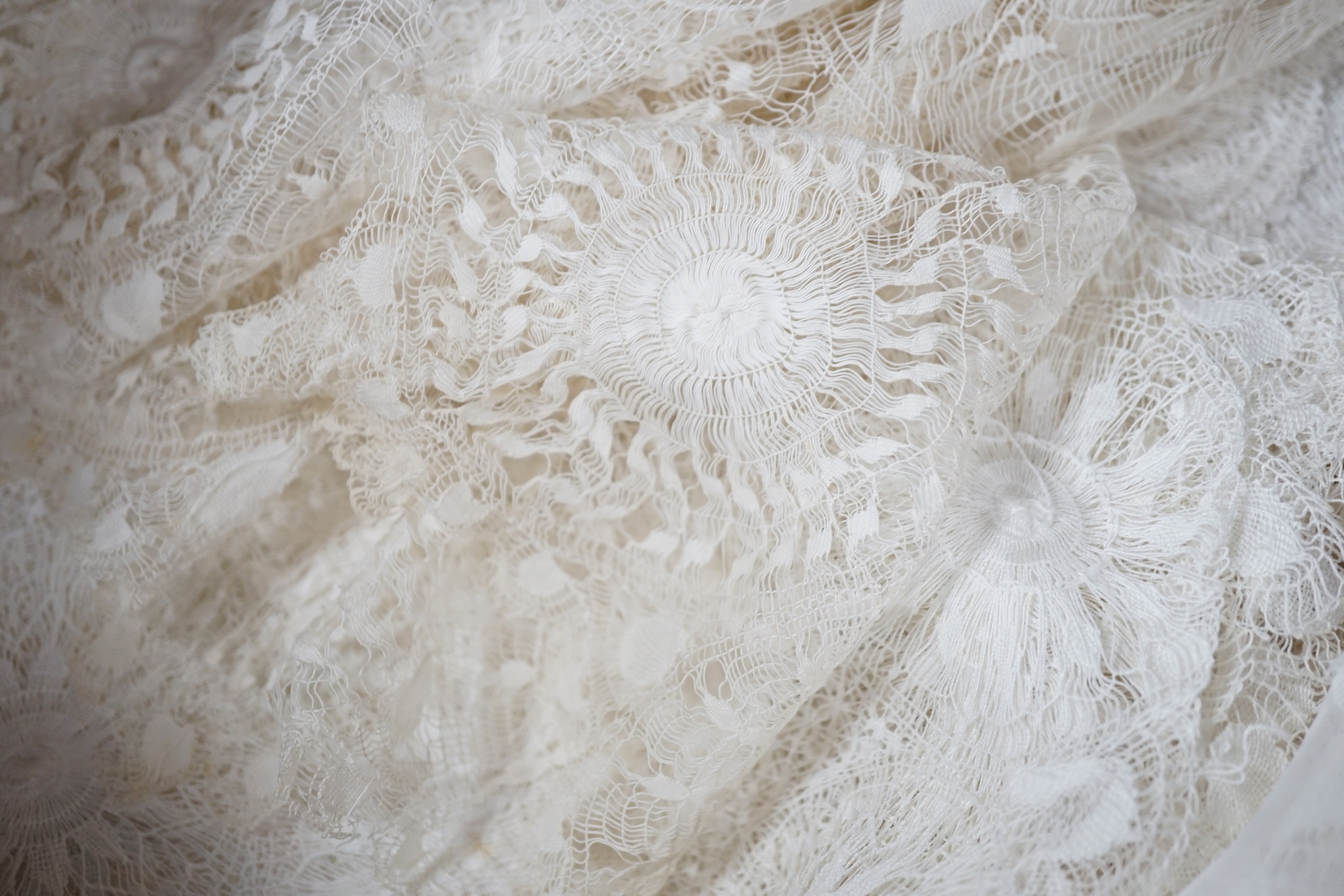 A collection of hand made finely worked tatting lace table linen, including cloths mats and napkins